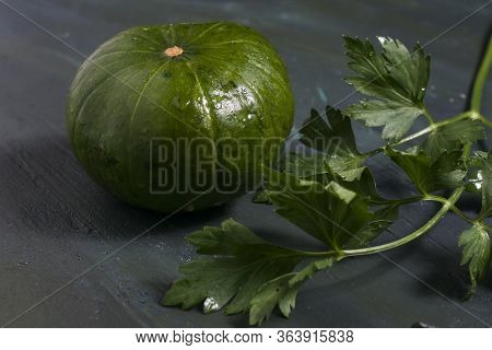 Argentinian's Pumpkin And Parsley On A Table