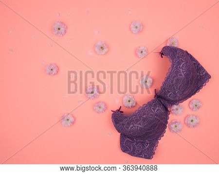 Purple Bra And Pink Flowers On A Pink Background. The View From The Top. Sakura. Almond Decorative.