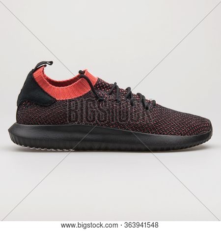 Vienna, Austria - February 19, 2018: Adidas Tubular Shadow Pk Black And Red Sneaker On White Backgro