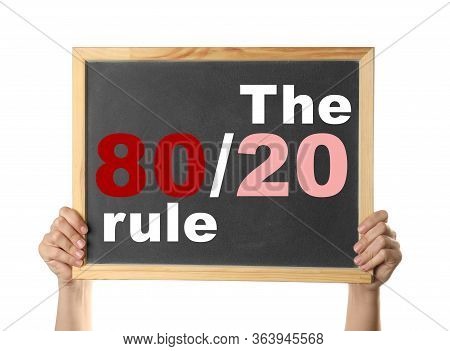 Pareto Principle Concept. Woman Holding Blackboard With 80/20 Rule Representation On White Backgroun