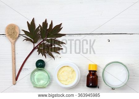 Ingredients For Homemade Facial Mask. Coconut Oil, Shea Butter, Essential Oil And Bentonite Clay On 