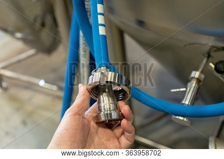 Beer Equipment Inside The Brewery. Gates, Pipe And Taps.