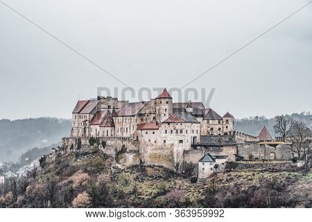 Burg Zu Burghausen, Castle Complex On Hill Along River During Rainy Days In Burghausen, Germany