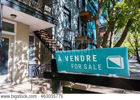 A Vendre (for Sale In French) Sign In Front Of A House