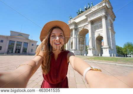Beautiful Smiling Traveler Girl Takes Self Portrait In Milan, Italy