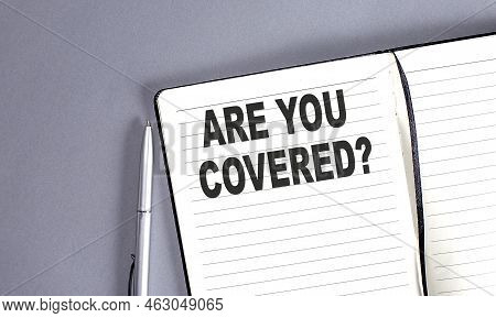 Are You Covered Word On Notebook With Pen