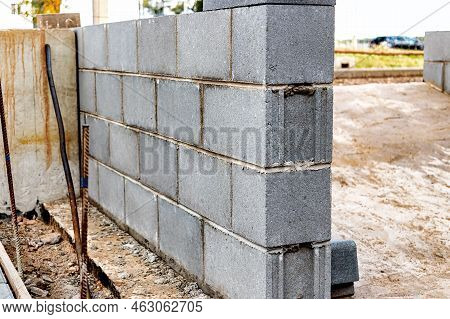 A Wall Of Hollow Concrete Blocks At A Construction Site. The Use Of Lightweight Concrete Blocks In C