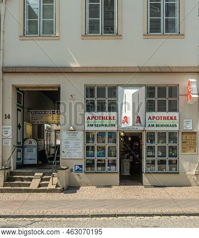 Germany, Lubeck - July 13, 2022: Beige Front Facade Of Am Behnhaus Pharmacy, Apotheke, With Entrance