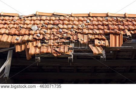 Closeup Of A Damaged Roof With Terracotta Orange Roof Tiles (pantiles, Coppo In Italian Language). I