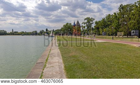 Palic, Serbia - August 01, 2022: Small Sailboat At Calm Water Of Palic Lake Nature Garden Park Summe