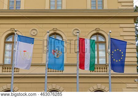 Szeged, Hungary - July 30, 2022: Flags Of University City Country And Eu Together In Front Of Univer