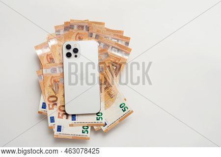 Stariy Oskol, Russia - July 5, 2021: New White Iphone On Euro Bills
