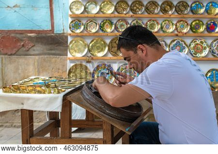 Bukhara, Uzbekistan - September 10, 2022: Master Of Artistic Coinage Works