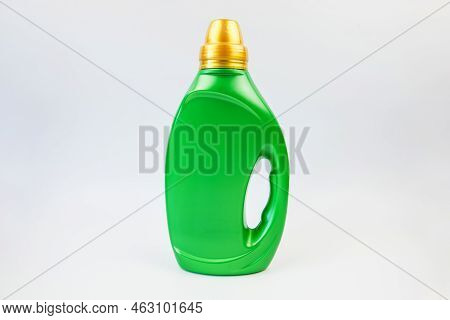 Detergent In A Bottle On A White Background. Detergent In A Container