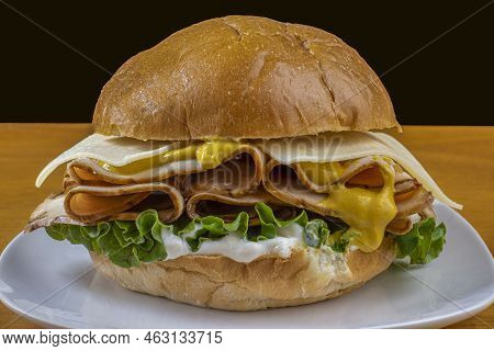 Turkey Meat Between A Brioche Bun  With Mustard Cheese And Mayonnaise