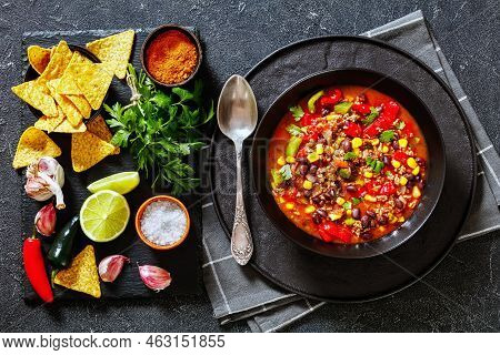 Taco Soup Of Ground Beef, Tomatoes, Chopped Green Chilis, Onions, Corn, Red Beans And Taco Seasoning