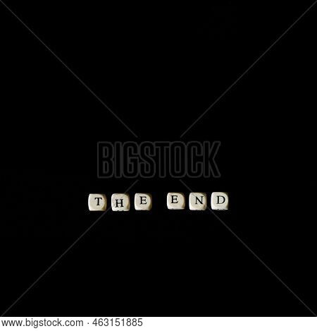 Inscription The End Of The Cubes On A Black Background. Tragedy, Ending, Pessimism And Predestinatio