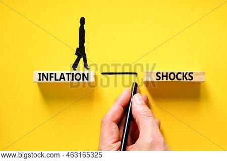 Inflation Shocks Symbol. Concept Words Inflation Shocks On Wooden Blocks. Beautiful Yellow Table Yel