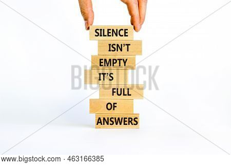 Answers In Silence Symbol. Wooden Blocks With Words Silence Is Not Empty It Is Full Of Answers. Beau