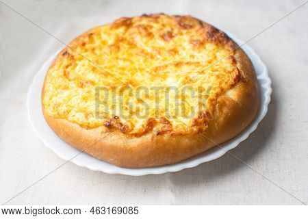 Shanga: Traditional Russian Pastries With Potatoes And Eggs. Khachapuri With Cheese, Egg And Garlic.