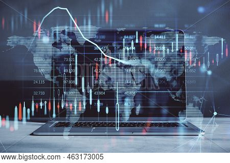 Close Up Of Laptop Computer With Glowing Candlestick Forex Chart And Map Hologram On Blurry Backgrou