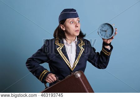 Stewardess Running Late At Airport, Holding Retro Alarm Clock, Carrying Baggage. Airplane Flight Att