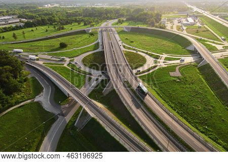 Aerial View Of Cars Driving On Round Intersection In City, Transportation Roundabout Infrastructure,