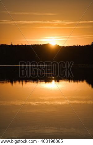 Sunset With Reflection On A Swedish Lake In Smalland. Romantic Evening Mood. Landscape Shot From Sca