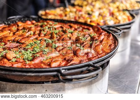 Large Hot Pan Full Of Wintery Comfort Food In A Form Of Suasage And Tomato Paste Stew.