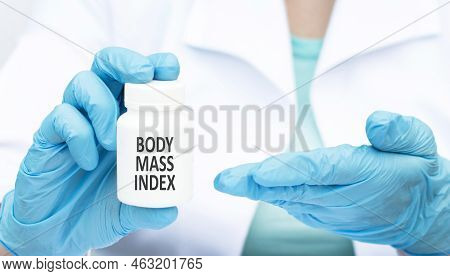 Medicine And Health Concept. The Doctor Has A Box Of Pills In His Hands, The Box Says - Bdi Body Mas