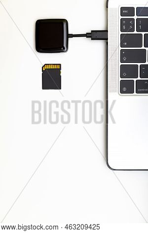 Memory Card And Card Reader Connected To Laptop. Memory Card. External Card Reader