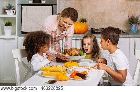 Traditional Thanksgiving Dinner. We Instill Traditions In Children. Serving A Prepared Festive Dish 