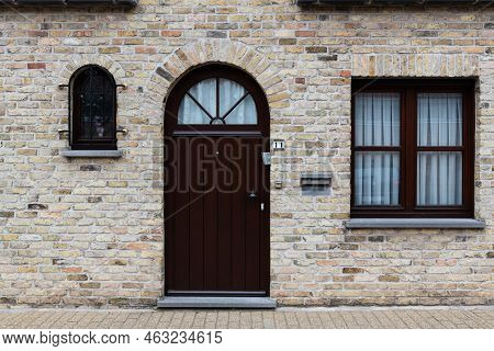 Veurne, West Flanders Region - Belgium - 07 18 2021 Rectangular Facade In Nature Stone With A Classi