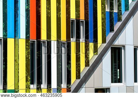 Dilbeek, Flemish Brabant Region, Belgium - 7 2 2021 Abstract Colors And Lines From The Facade Of A C