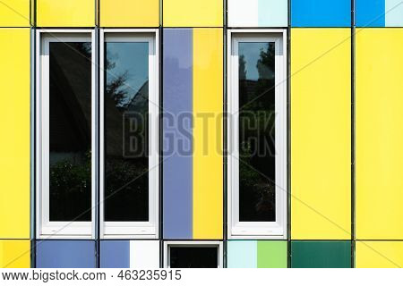 Dilbeek, Flemish Brabant Region, Belgium - 7 2 2021 Abstract Colors And Lines From The Facade Of A C