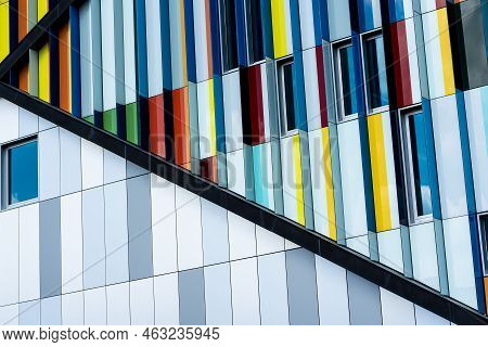 Dilbeek, Flemish Brabant Region, Belgium - 7 2 2021 Abstract Colors And Lines From The Facade Of A C