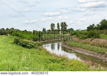 The Meandering River Senne With The Green Banks And A Bicycle Trail, Zemst, Belgium