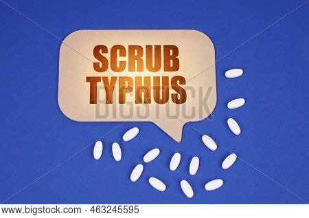 Medical Concept. On The Blue Surface Of The Tablet And A Cardboard Plate With The Inscription - Scru
