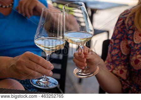 Drinking Of Txakoli Or Chacolí Slightly Sparkling Very Dry White Wine Produced In Spanish Basque Cou