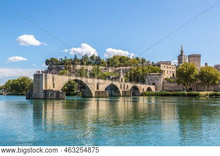 Saint Benezet Bridge And Palace Of The Popes In Avignon In A Beautiful Summer Day, France