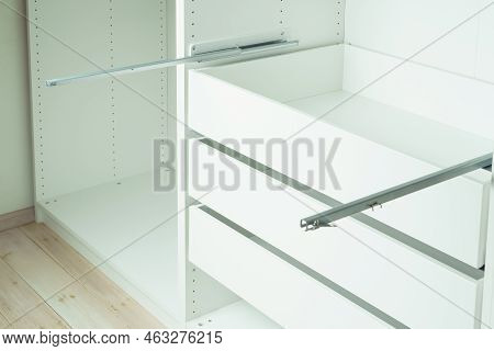 Drawer Rail Inserted Into Cabinet, Fixed With Self-tapping Screws. Assembling White Dresser Or Wardr
