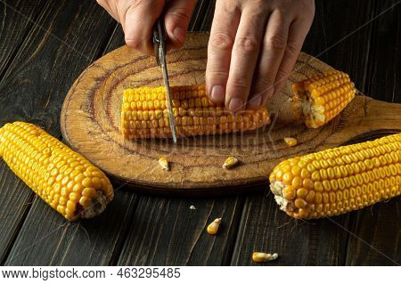 The Chef Cuts Corn With A Knife. Maize Is An Excellent Dietary Breakfast Or Lunch With Vegetables. W
