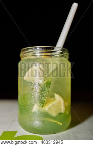 Mojito Drink In A Creative Glass On The Table On A Dark Background