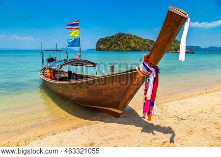 Thai Traditional Wooden Longtail Boat At Tropical Beach In Thailand