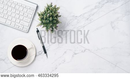 White Office Desk With Keyboard, Pen And Cup Of Coffee, Top View Wth Copy Space, Flat Lay.