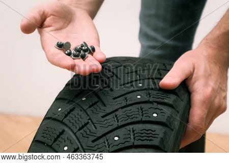 Renew Lost Studs. Hand With Repair Steal Studs. Worn Tire Tread, Winter Studded Tire - Wheel Repair 
