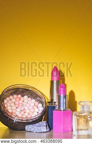 Makeup Products And Decorative Cosmetics On Zellow Background Flat Lay. Fashion And Beauty Blogger C