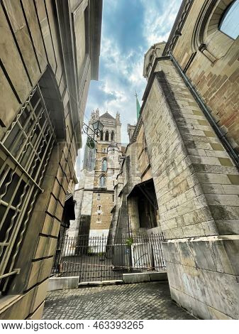 Geneva, Switzerland - September 15 2021: A Low Angle View Of A Very Small Medieval Alley With View O