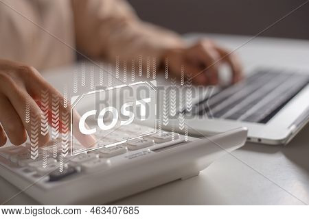 Accountants Using Calculator To Calculate Corporate Cost Reduction.