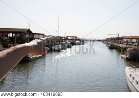 Woman Palm Finger Pointing Horizon In Arcachon Bay In Port Andernos Harbor High Tide